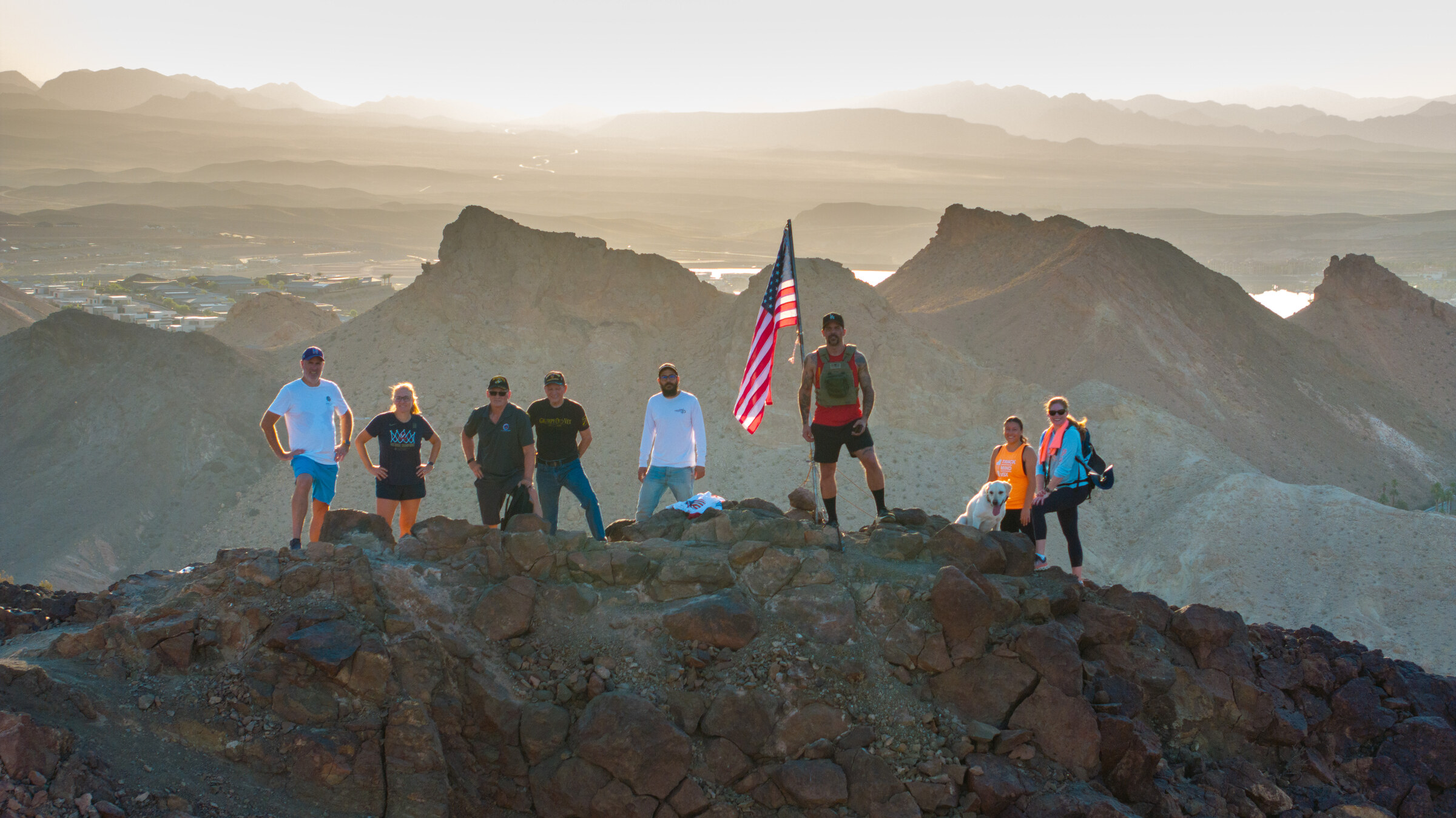 Group on a desert ridge photographed from a drone